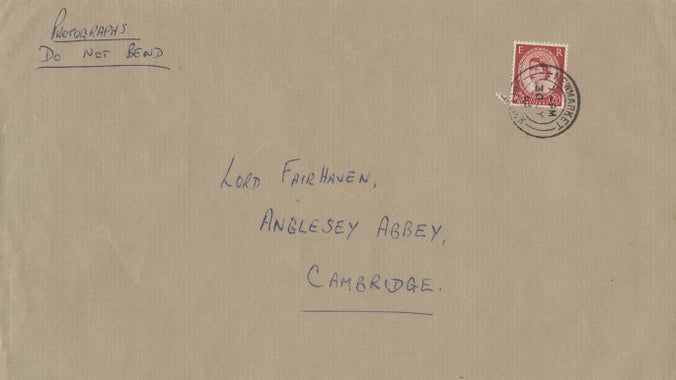 A photo of a brown envelope, it is addressed to Lord Fairhaven, Anglesey Abbey, Cambridge. In the top corner is written "Photographs, do not bend"